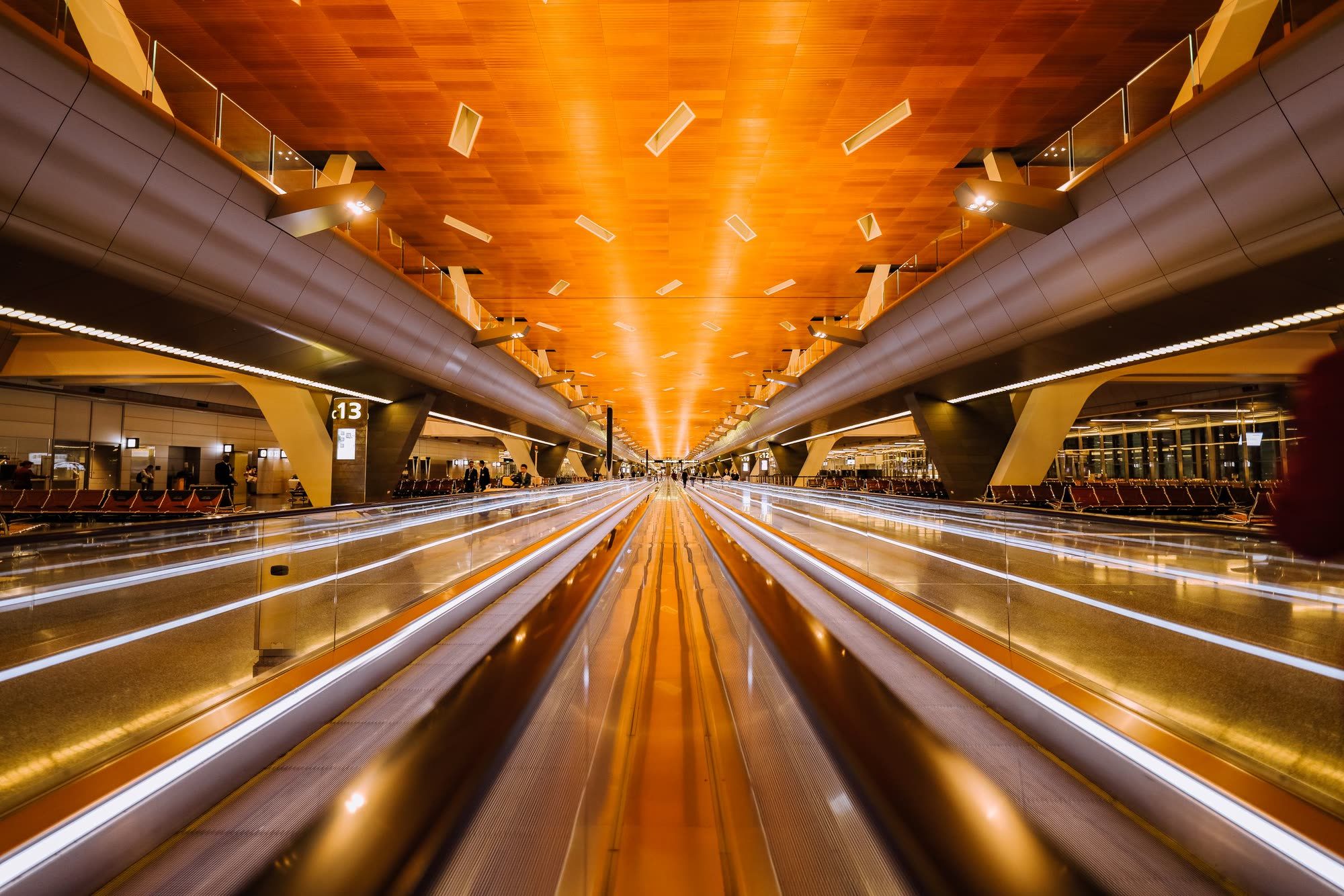 Airport arrivals hall with passengers and luggage